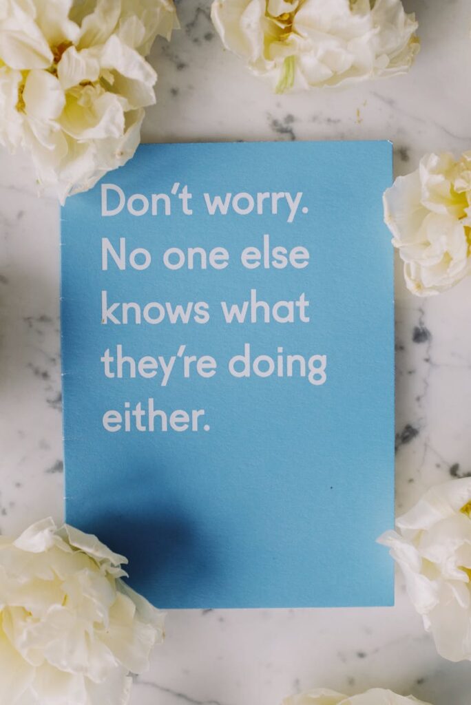 Extraordinary Quotes blue card surrounded with flowers